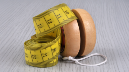 Image of a yo yo with a tape measure 